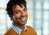 Horizontal headshot of an attractive african american businessman shot with shallow depth field.